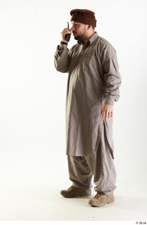 Luis Donovan Afgan Civil with Walkie-Talkie standing talking whole body…